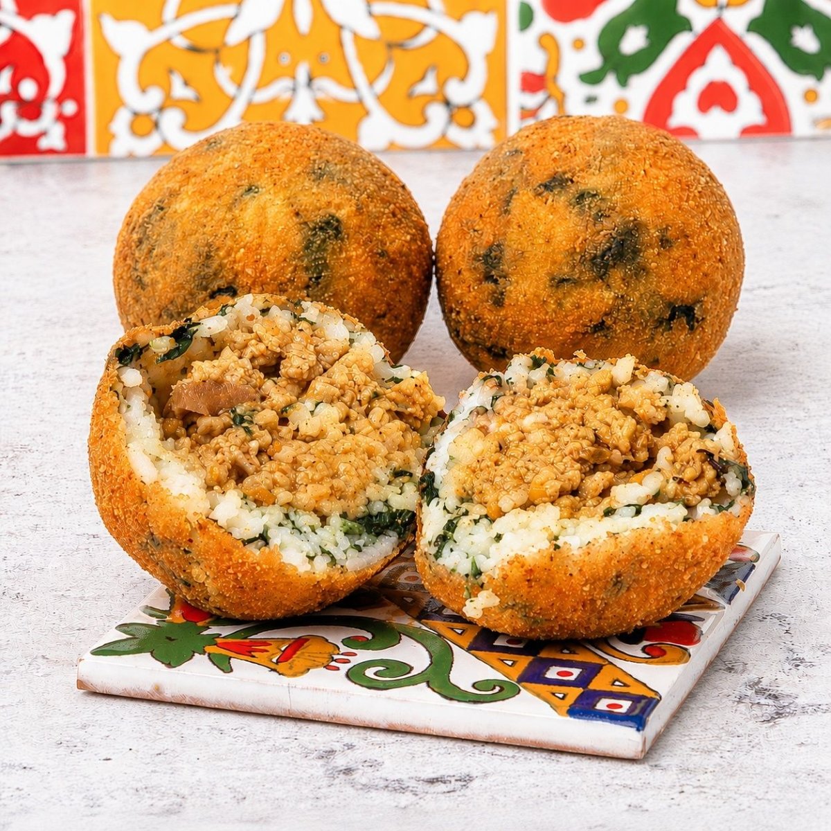 Arancini al ragù bianco con riso ai funghi e spinaci - SicilyAddict