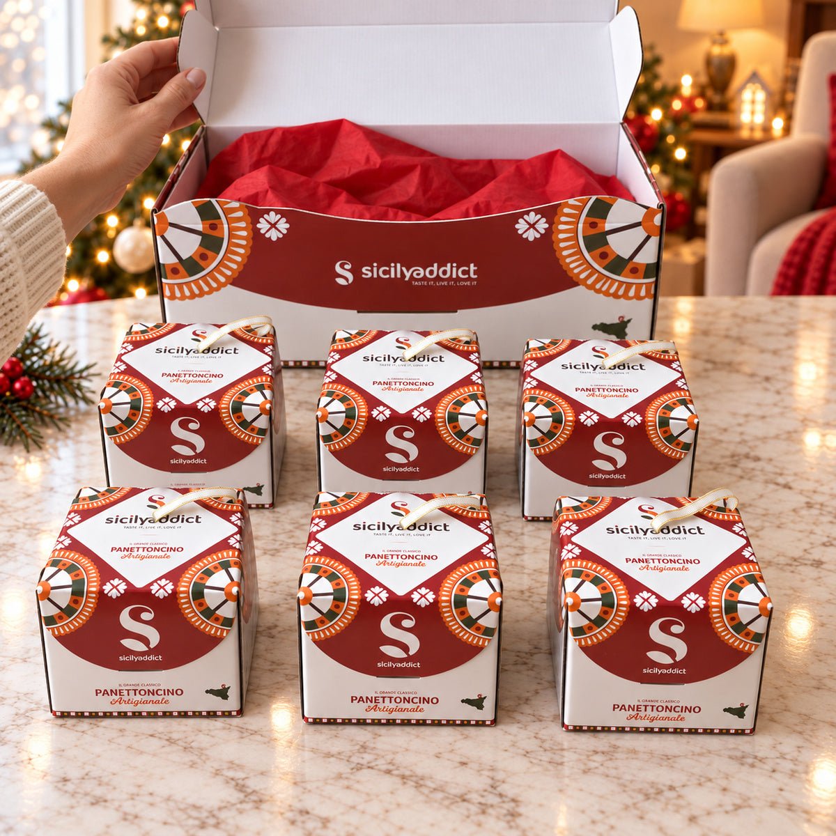 Box di 6 panettoncini assortiti con scatola aperta mostrata a mano e confezioni singole in primo piano.