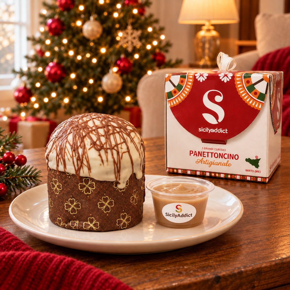 Panettoncino al cioccolato e nocciole Ciokonocciola accanto alla confezione regalo e alla crema separata.