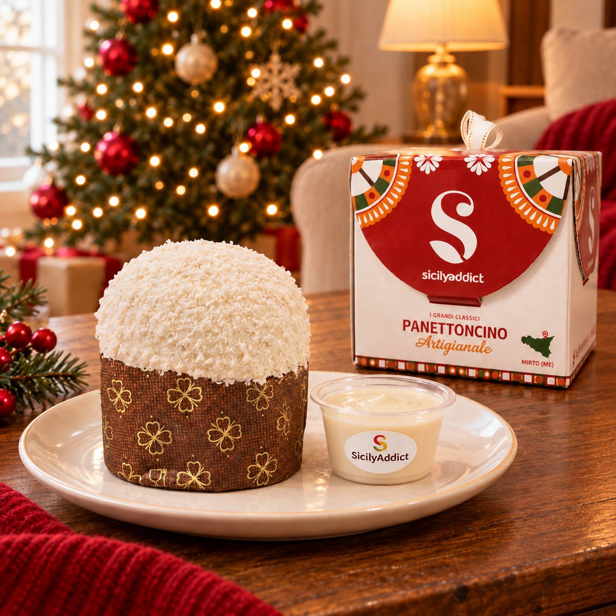 Panettoncino ciokococco accanto alla confezione regalo e alla crema separata.